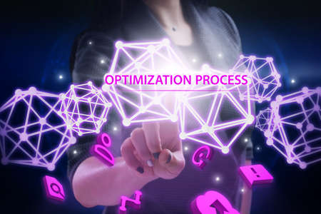 Business, Technology, Internet and network concept. Young businessman working on a virtual screen of the future and sees the inscription: Optimization processの写真素材