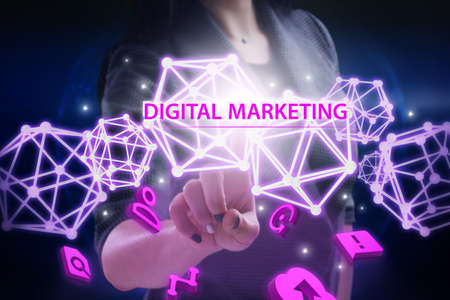 Business, Technology, Internet and network concept. Young businessman working on a virtual screen of the future and sees the inscription: Digital marketingの写真素材