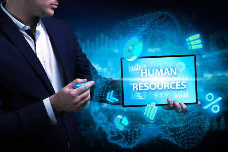 Business, Technology, Internet and network concept. Young businessman working on a virtual screen of the future and sees the inscription: Human resourcesの写真素材