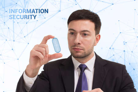 Business, technology, internet and network concept. Young businessman thinks over the steps for successful growth: Information securityの写真素材