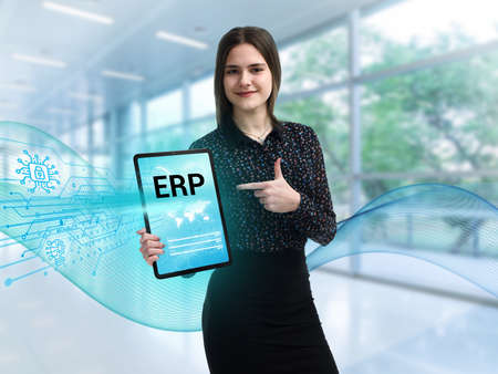 Business, Technology, Internet and network concept. Young businessman working on a virtual screen of the future and sees the inscription: ERPの写真素材