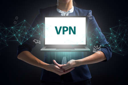 Business, Technology, Internet and network concept. Young businessman working on a virtual screen of the future and sees the inscription: VPNの写真素材