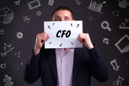 Business, technology, internet and network concept. Young businessman thinks over the steps for successful growth: CFOの写真素材