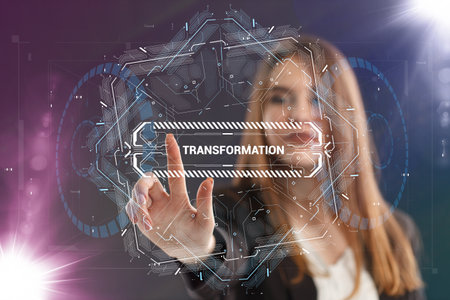 Business, Technology, Internet and network concept. Young businessman working on a virtual screen of the future and sees the inscription: Transformationの写真素材