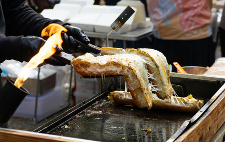Grilled long bread with mozzarella cheese at street food festival, South Tangerang.の写真素材