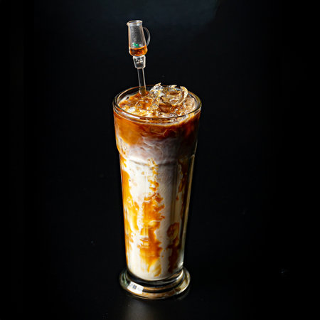 Iced caramel latte with caramel sauce on the wall of the glass, refreshing and sweet coffee drink