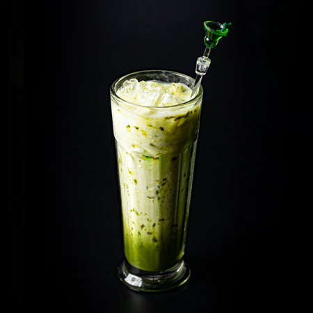 Delicious Vegan Matcha Ice Latte In Glass On Black Background Closeup Viewの写真素材