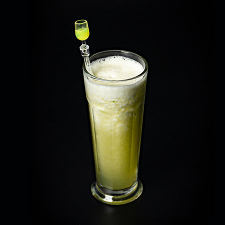 Fresh Honeydew Melon Juice on black backgroundの写真素材