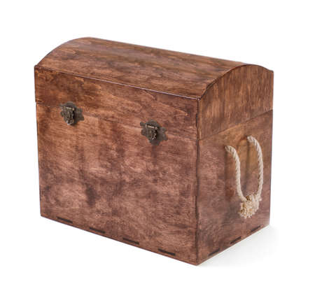 The high and large brown chest for the cubes, toys or multi-colored wooden blocks, isolated on a white background. The wooden box for the game. The chest is closed with colorful and wooden cubes.の写真素材