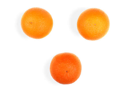 Three big ripe juicy oranges, isolated on a white background. Citrus fruits. Set of fresh orange fruits, close-up. Exotic and tropical fruits. Fresh, bright and juicy oranges.の写真素材