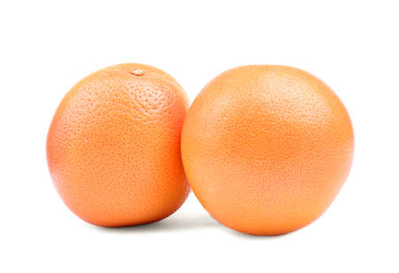 Two big ripe juicy and organic oranges, isolated on a white background. Close-up of two juicy and ripe oranges. Fresh, bright and juicy oranges. Ripe citrus fruits. Orange fruits.の写真素材