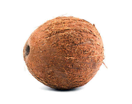 Close fresh coconut, isolated on a white background. Exotic fruit coconut. A whole and tasty brown coconut. Freshness, nature, summer concept. A tropical coconut. Healthful lifestyle.の写真素材