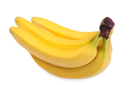 The raw organic bunch of bananas ready to eat, isolated on a white background. Close-up picture of delicious, nutritious and incredibly bright yellow bananas.の写真素材