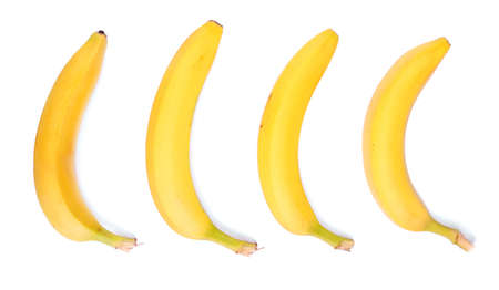 Set of fresh and sweet bananas, isolated on a white background. Ripe and tasty bananas. Four sweet fruit of bananas. Bright yellow bananas. Vitamins. A group of tropical fruits.の写真素材