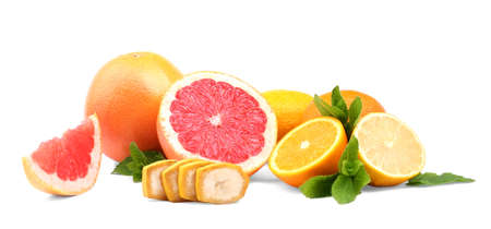 A mix of beautiful summer fruits isolated over the white background. Fresh organic citruses with a cut banana and green peppermint leaves. Health, organic, freshness concept.の写真素材
