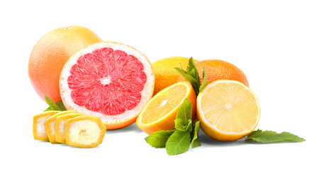 A group of fresh bright fruits and green mint leaves isolated over the white background. Red raw grapefruit, nutritious yellow lemon, sliced colorful oranges.の写真素材