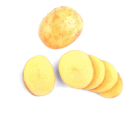 Carefully sliced bright brown potato isolated on a white background. Delicious potatoes for vegetarian nutritious diets. Healthful agriculture ingredients for homemade meals.の写真素材