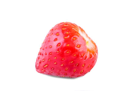 A macro photo of juicy and fresh bright red strawberry, isolated on a white background. A small, ripe and perfectly strawberry. Nutritious vitamins. Healthy breakfast.の写真素材