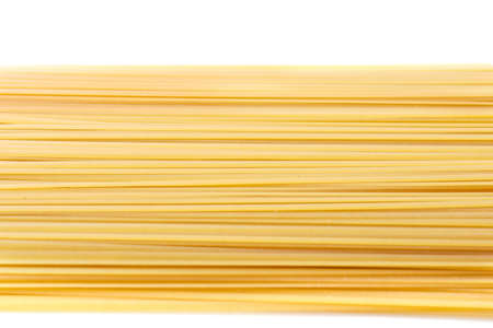 Top view of raw and rigate noodle pasta, isolated on a white background. Flour products. Raw homemade pasta. Makaroni meal for dinner. Italian spaghetti pasta dried food.の写真素材