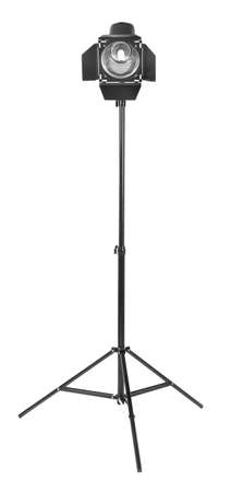 Studio flash with barn door, isolated on a white background. Photo-studio with lighting equipment. Studio lighting on a tripod stand. Spot light photography equipment.の写真素材