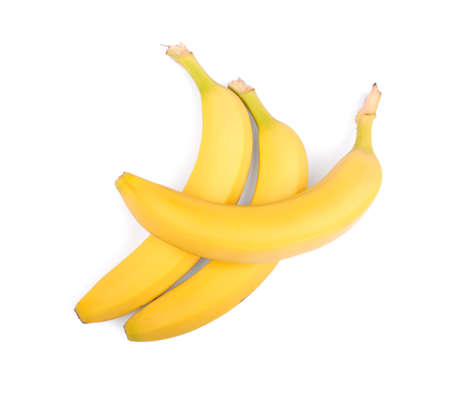 Three whole and fresh bananas, isolated on a white background. Ripe and tasty bananas. Sweet fruit of bananas. Vitamins. A group of tropical fruits. Vegetarian snack.の写真素材