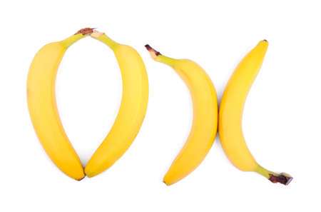 A close-up colorful delicious bananas isolated over the white background. Appetizing bananas forming a word "OK". Refreshing nutritious tropical fruits.の写真素材