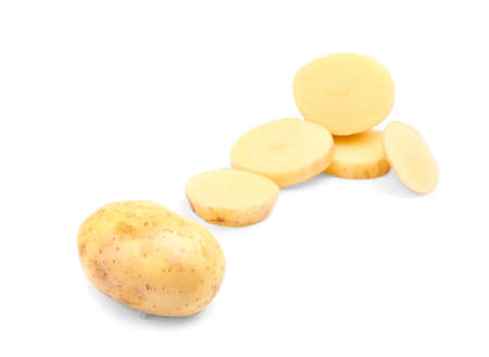 A group of perfectly round slices of chopped potatoes and a whole veggie isolated over the bright white background. Potatoes full of starch. Agriculture, plant, farming concept.の写真素材