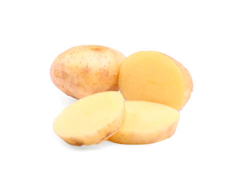 Beautiful uncooked potatoes isolated over the white background. Tasteful autumn vegetables full of vitamins. Organic ingredients for delicious dinner and nutritious snacks.の写真素材