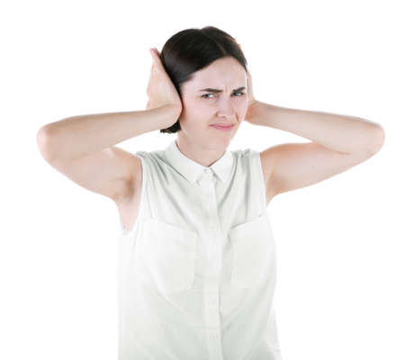 An adorable brunette female isolated over the white background. A shocked, disgusted woman closing...