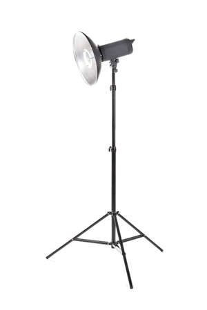 Professional studio flashlight, isolated on a white background. Photographic studio light with a tripod. A reflector, an outbreak on a tripod. Photo equipment.の写真素材