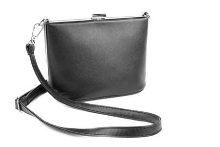 Woman's fashion luxury and leather black handbag, isolated on a white background. Black female bag with long handles. Stylish lady's handbag. An elegant girl's bag.の写真素材