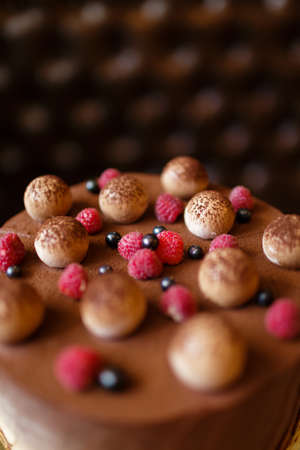 Top view of a dessert cake from mascarpone cheese, coffee espresso, eggs, sugar, cookies, and...