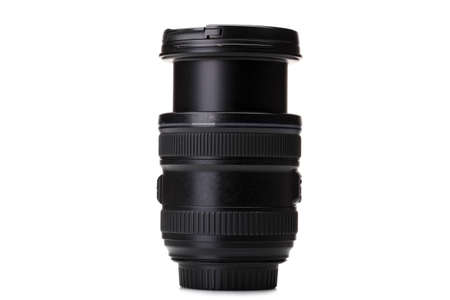 Close-up of camera lens isolated on a white background. Huge optical lens for modern cameras. Copy space.の写真素材