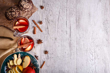 Hot red tea with fruits and chocolate muffins on a table background. Healthy breakfast. Copy space.の写真素材