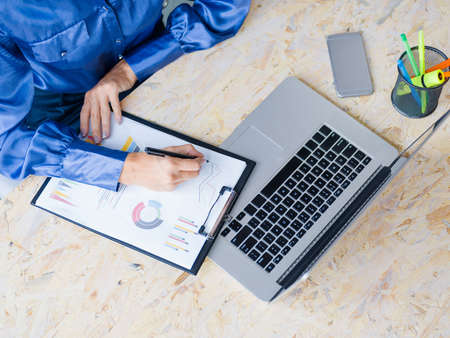 View of male hands on laptop on the light table background. Business concept.の写真素材