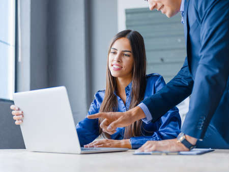 Successful business partners working with laptop in the office. Business concept.