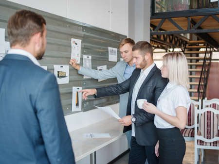 Business consultants while working in a team.A group of young workers at a meeting in the company conference room. Business concept.の写真素材