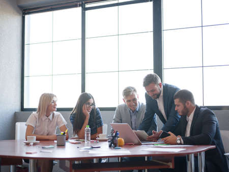 Business consultants while working in a team.A group of young workers at a meeting in the company conference room. Business concept.の写真素材