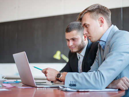 Business consultants while working in a team.A group of young workers at a meeting in the company conference room. Business concept.の写真素材