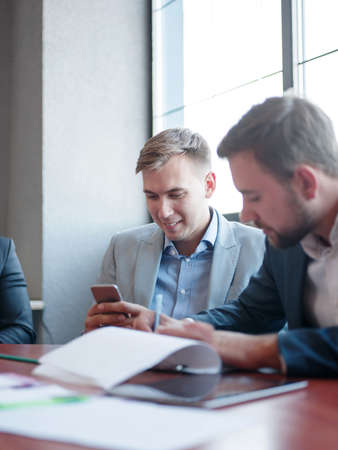 Business consultants while working in a team.A group of young workers at a meeting in the company conference room. Business concept.の写真素材
