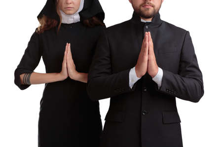 Nun and priest praying isolated on a white background.