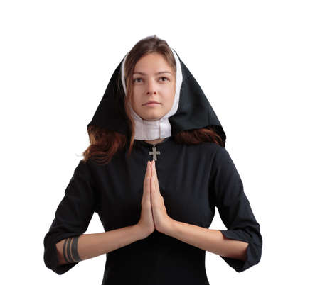 Pretty young nun in religion concept isolated on a white background.
