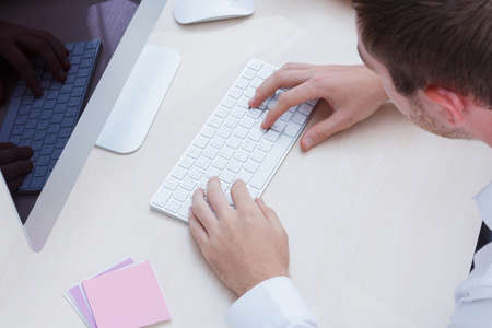 Top view close up of hands with keyboardの写真素材