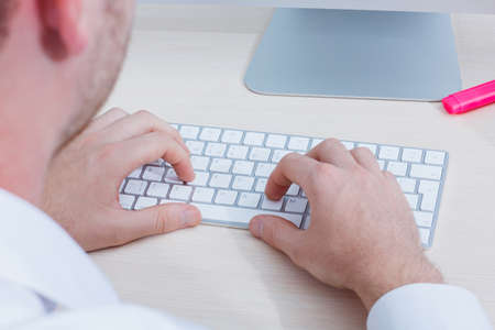 Top view close up of hands with keyboardの写真素材