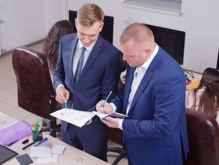 Young colleagues working in the office on a schedule.の写真素材