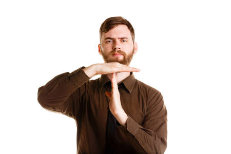 Handsome man with beard posing and standing isolated on a white background.の写真素材