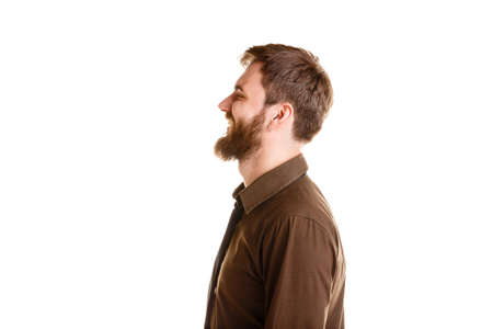 Handsome man with beard posing and standing isolated on a white background.の写真素材