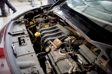 Car parts under the open hood close-upの写真素材