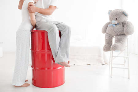 Young loving couple hugging each other, smiling and posing on camera isolated on a white background.の写真素材