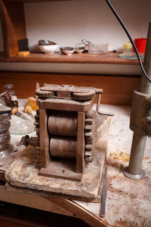 Old crafting equipment on a table background. Craftsmaking and jewelry production. Goldsmith...